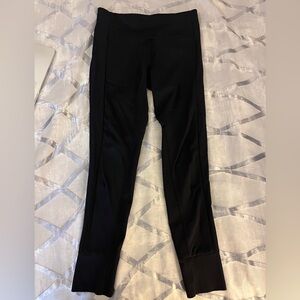 Athleta leggings women’s size SP.  black back zipper pockets cuff bottom.